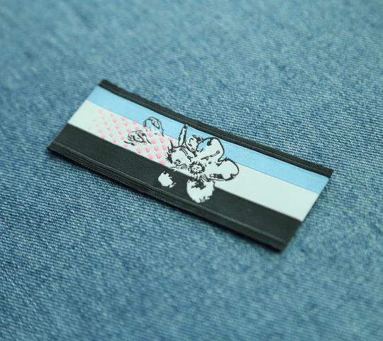 Embossed Distinctive Flower Woven Label