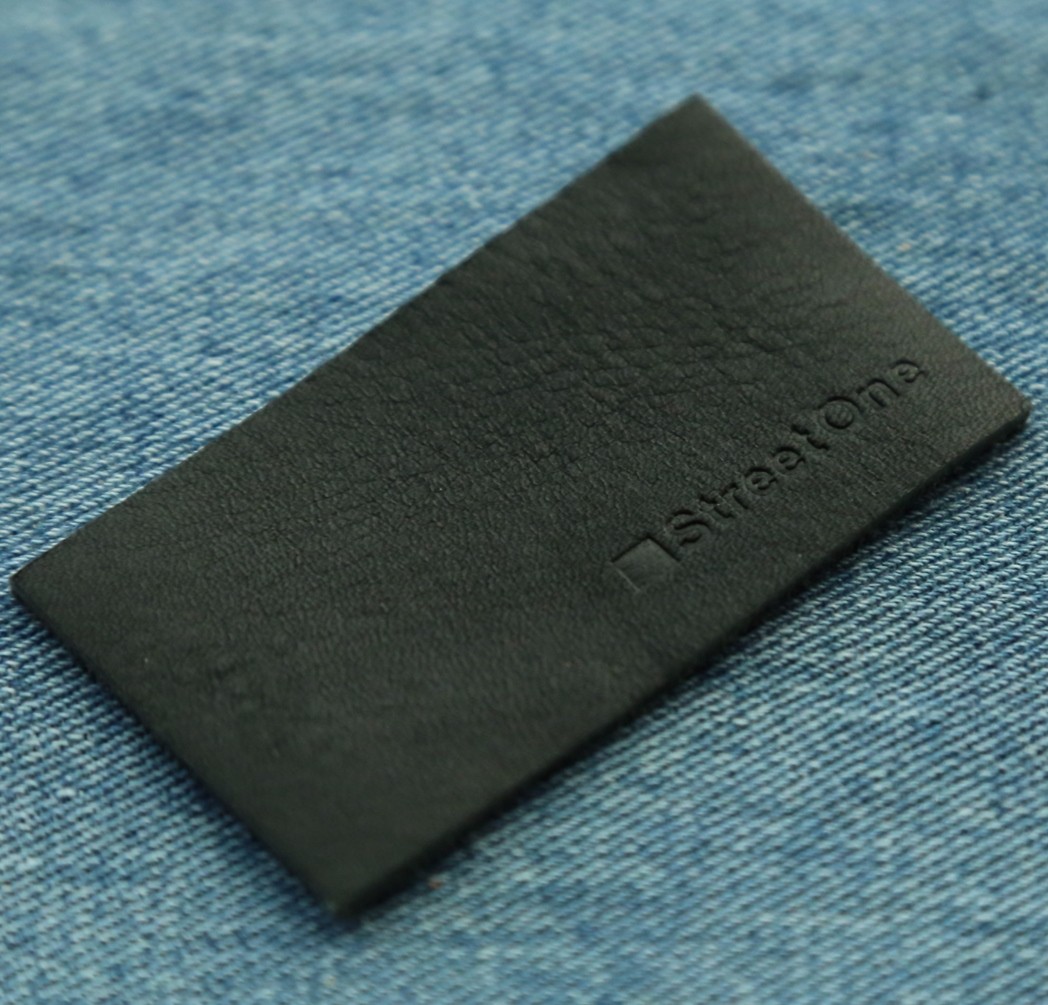 debossed brand name leather label